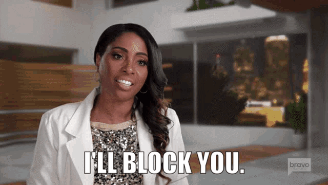 a woman says " i 'll block you " in front of a bravo sign