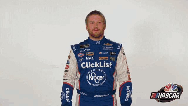 a man wearing a blue and white nascar outfit