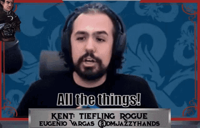 a man with a beard wearing headphones and a sign that says `` all the things '' .