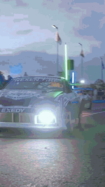 a race car with exedy written on the side of it