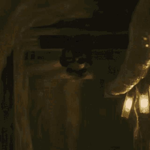 a close up of a chandelier in a dark room