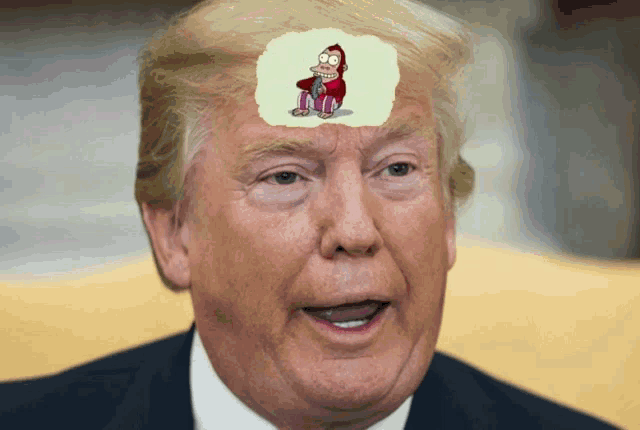 donald trump has a cartoon of a monkey on his forehead