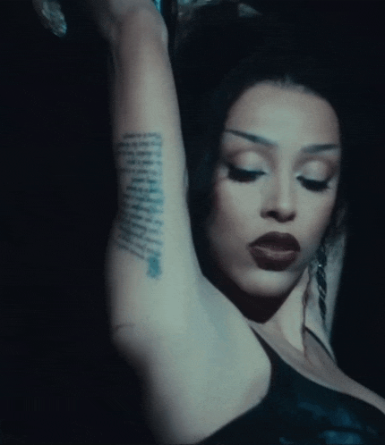 a close up of a woman 's arm with a tattoo that says ' i love you ' on it