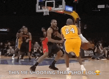 a basketball player wearing a yellow jersey with the number 24 on it is shooting a shot .