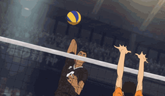 a volleyball player with the number 4 on his jersey jumps to hit the ball