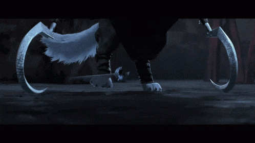 a close up of a person 's feet with a sword in the dark