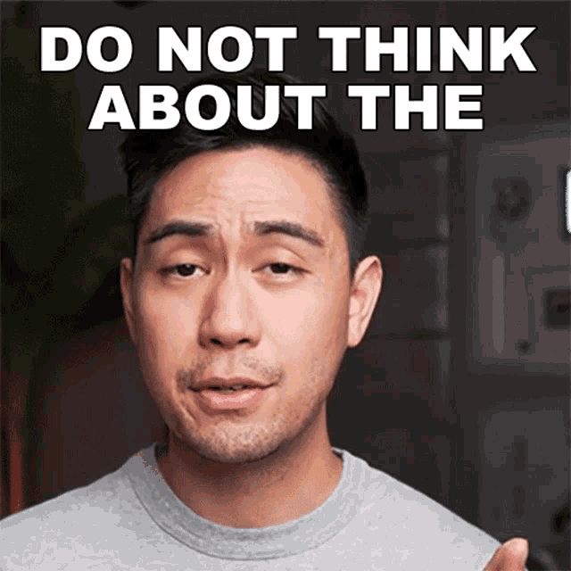 a man says do not think about the in a gray shirt