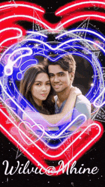 a man and a woman are hugging in front of a heart with the name wiluco @ mhine on the bottom