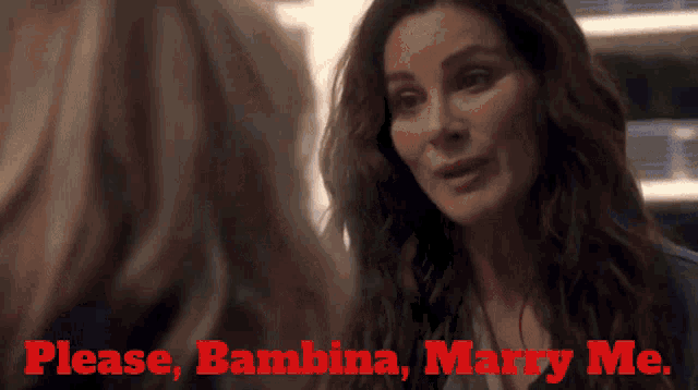 a woman says please bambina marry me in red