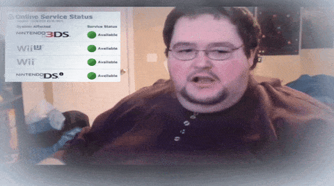 a man sitting in front of an online service status screen