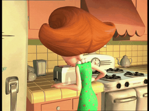 a woman in a green dress is using a toaster oven that says super oven on it