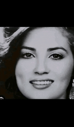 a close up of a woman 's face with the word ba written below it
