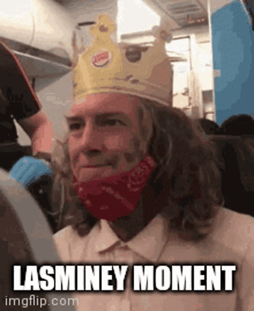 a man wearing a burger king crown and a red bandana says lasminey moment .