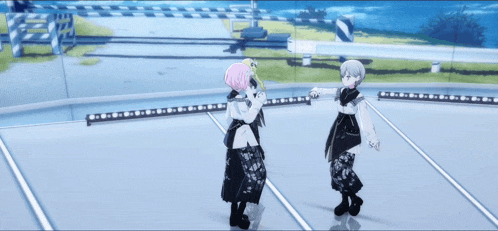 two anime characters are dancing on a stage