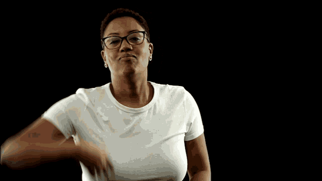 a woman wearing glasses and a white shirt has her hand on her face