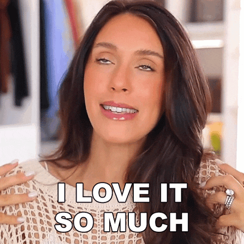 a woman says " i love it so much " in front of a wardrobe