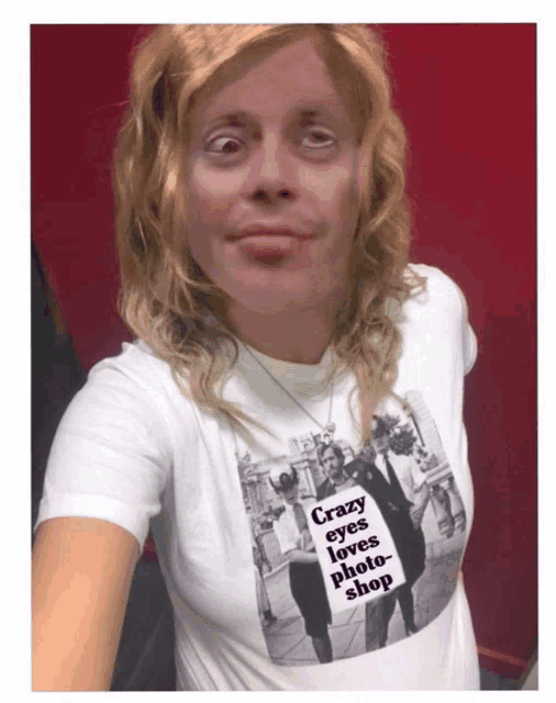 a woman is wearing a white shirt that says crazy eyes loves photoshop