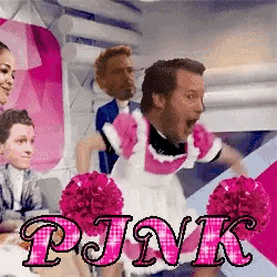 a man dressed as a maid is surrounded by pink cheerleaders