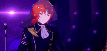 a man with red hair is standing in front of a microphone in a dark room
