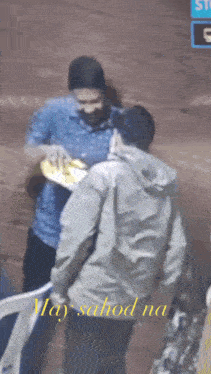 a man giving a plate to another man with the words may sahod na written on the bottom