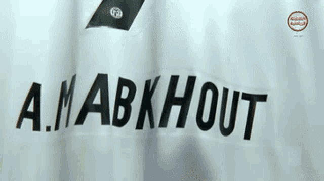 a close up of a shirt that says a.m. abkhout