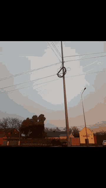 a rainbow is visible over a residential area