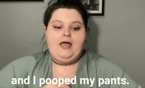 a woman says " and i pooped my pants " in front of a picture