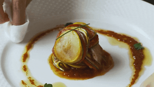 a close up of a plate of food with a sauce on it