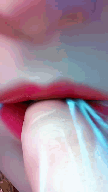 a close up of a person 's lips with red lipstick on