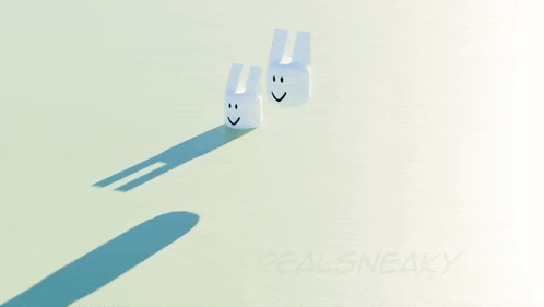 two white rabbits with smiley faces are standing next to each other on a white surface