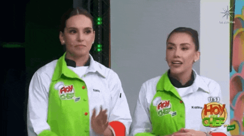 two women wearing green and white jackets with hoy chef on them