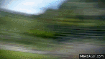 a blurry picture of a field with the words make a gif.com at the bottom