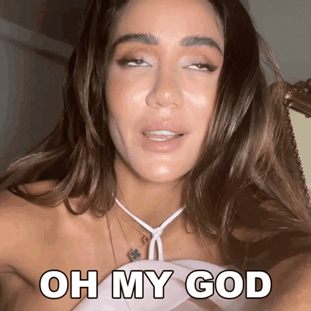 a woman is making a funny face with the words oh my god below her