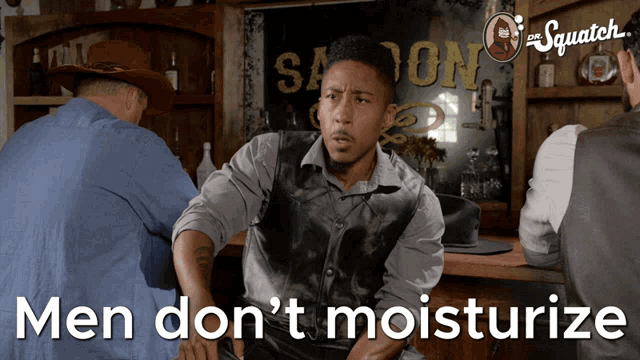 a man sits at a bar with the words men do n't moisturize