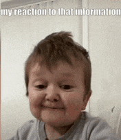 a baby is smiling and making a funny face .