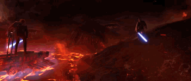 a man holding a lightsaber stands in front of a volcano in the dark