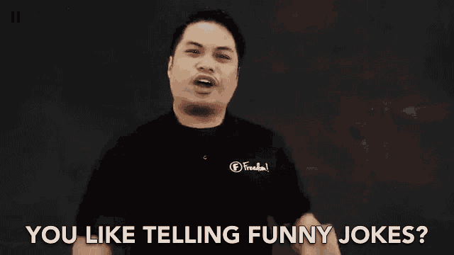 a man is pointing at himself and saying `` you like telling funny jokes '' .