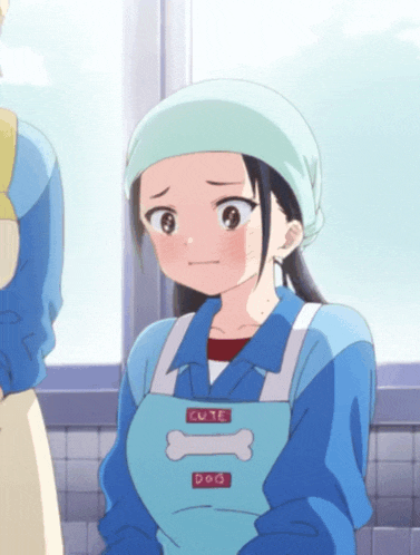 a girl wearing a blue apron that says cute dog