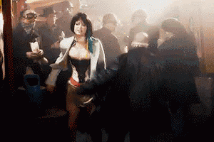 a woman with blue hair is standing in a crowd