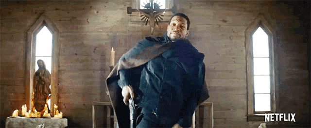 a man in a cape holding a gun in a church with netflix written on the bottom