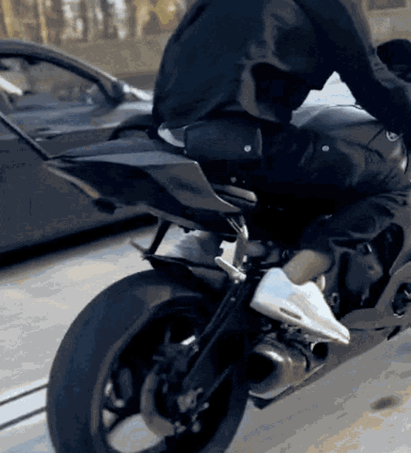 a man is riding a motorcycle on a street