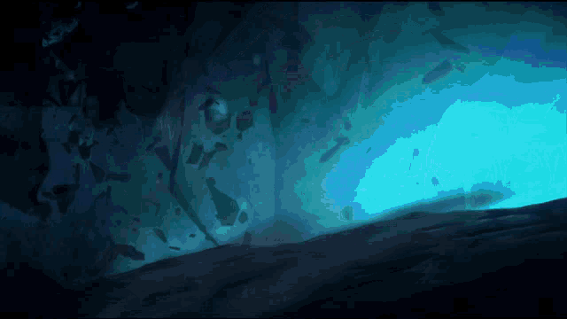 a dark cave with a blue light coming out of the bottom