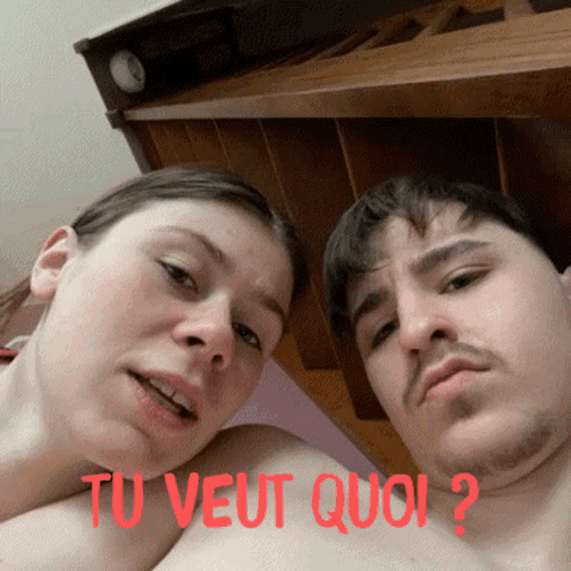 a man and a woman are posing for a picture with the words tu veut quoi written on the bottom