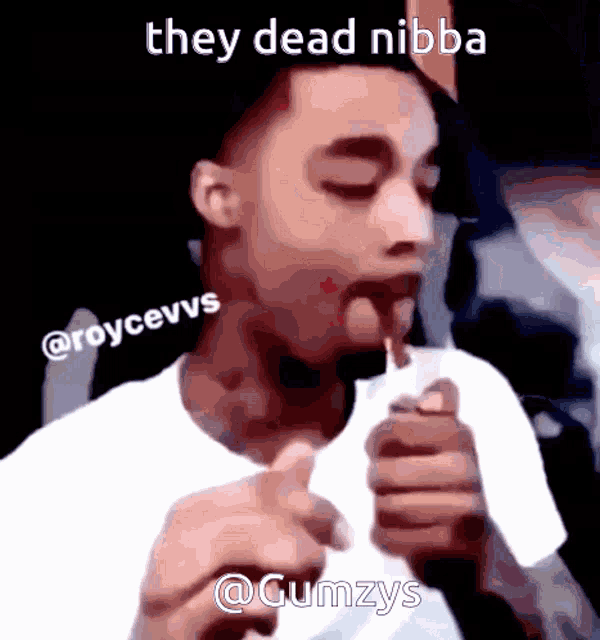 a picture of a man smoking a cigarette with the caption they dead nibba @gumzys