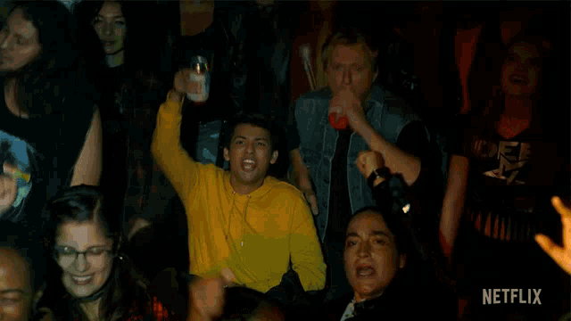 a group of people are watching a netflix video