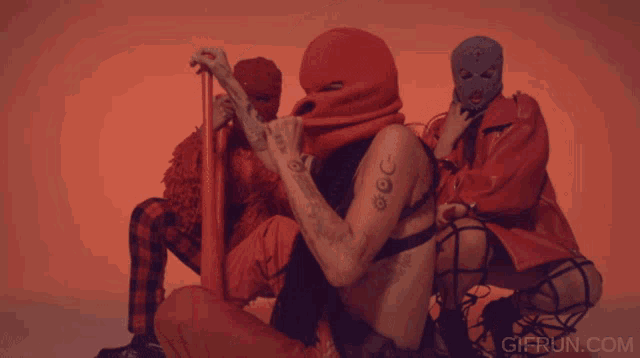 a gif from gifrun.com features a woman in a black bra
