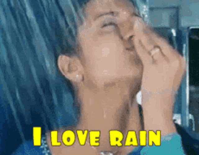 a woman is taking a shower with the words " i love rain " above her