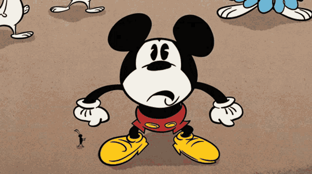 a cartoon of mickey mouse covering his eyes