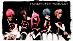 a group of people are posing for a picture with a smiley face on their shirt