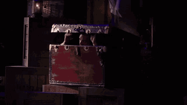 a man is standing in a trunk that says " vanilla " on the side